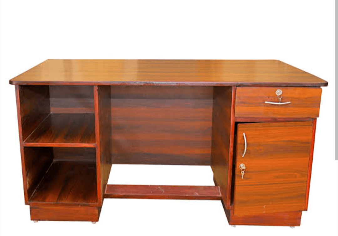 This contemporary modern wooden Executive table  made of teakwood with top mica finishing with one drawer and cupboards with footrest. It looks very stylish and comfortable to work on it.
